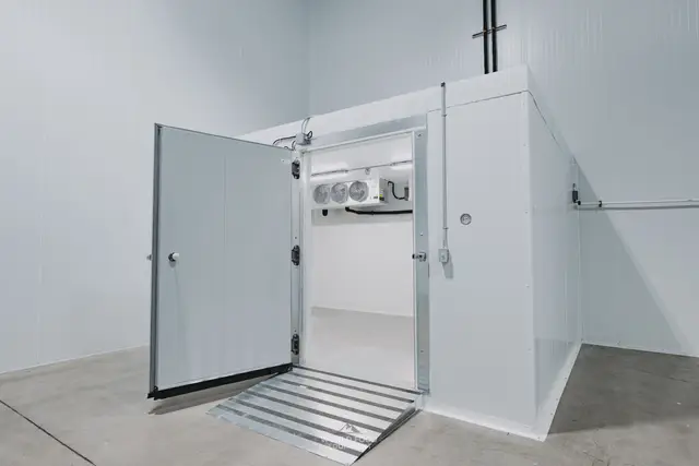 Walk-in cooler door open in a Mississauga cold room