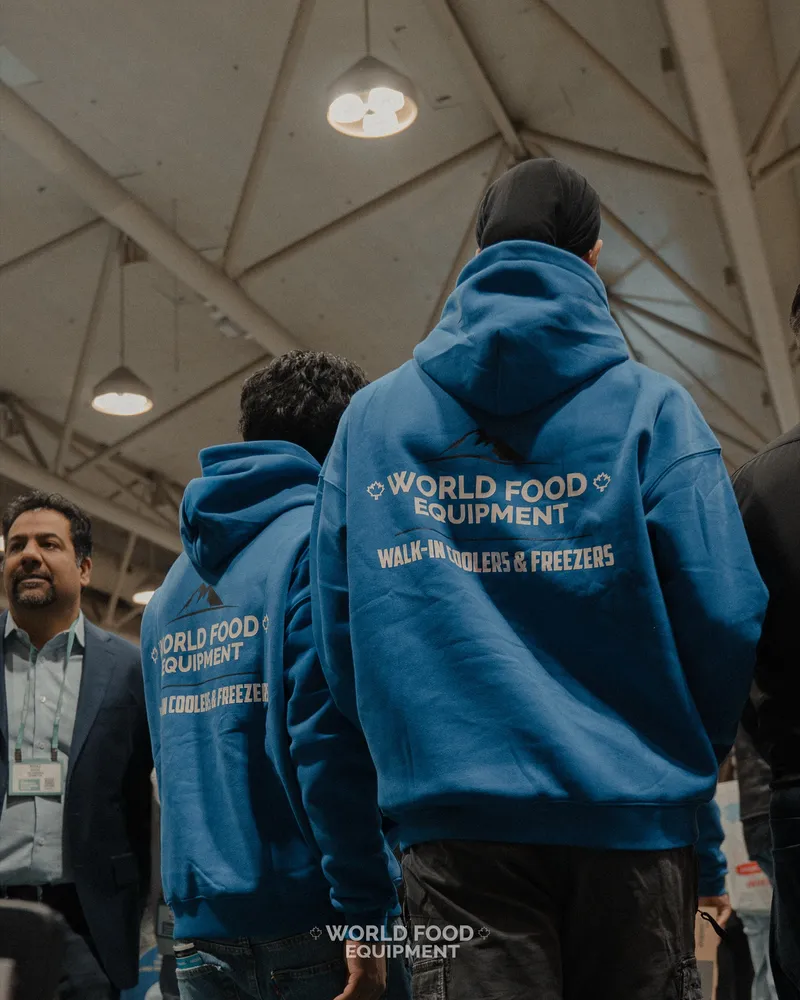 World Food Equipment crew in WFE branded Walk-In Coolers and Freezers hoodies at an industry trade event