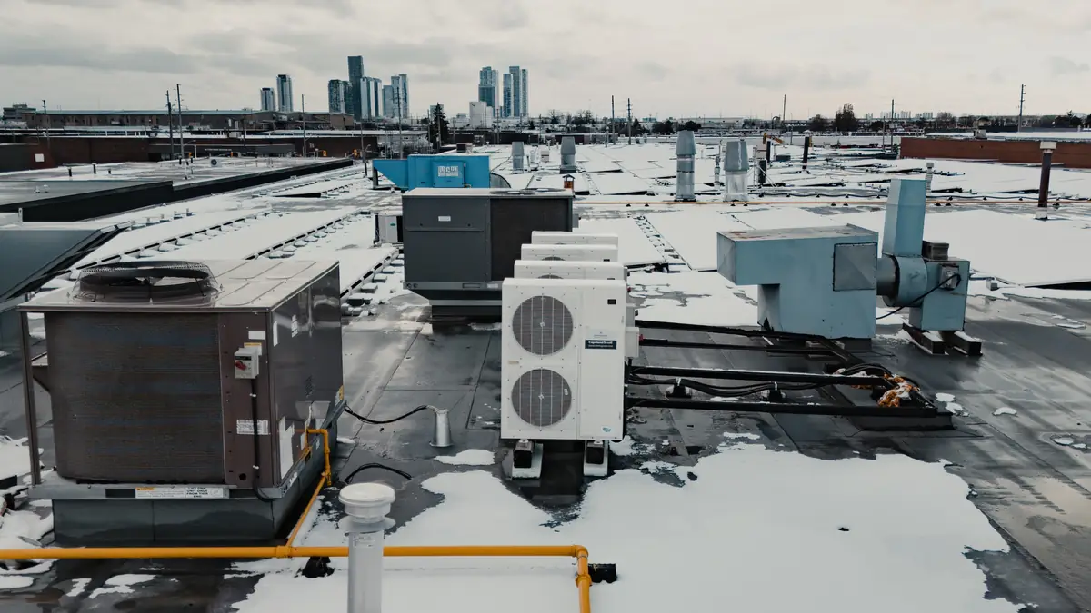 Copeland Scroll outdoor condensing units on a snowy Toronto rooftop serving a walk-in cooler, WFE install